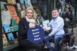 Photo of Joanna Marsden, co-author of Never Know Your Place with  activist James Cawley at Hoggis Figgis bookshop 